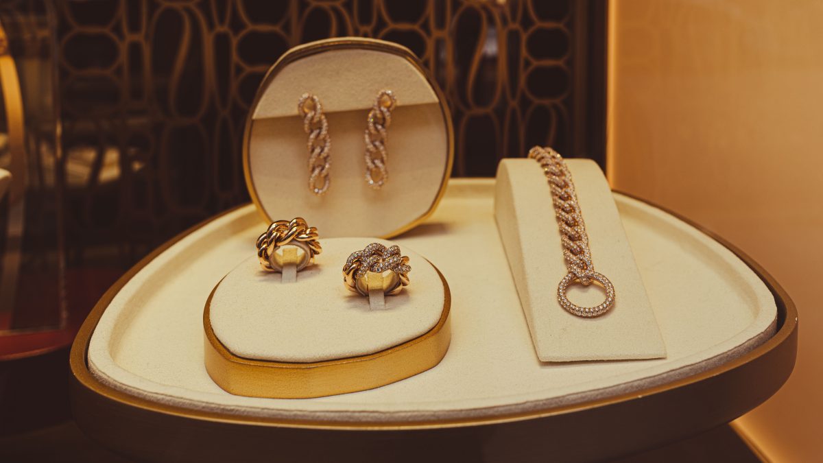 Refined display of gold jewelry pieces in a store setting