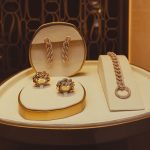 Refined display of gold jewelry pieces in a store setting