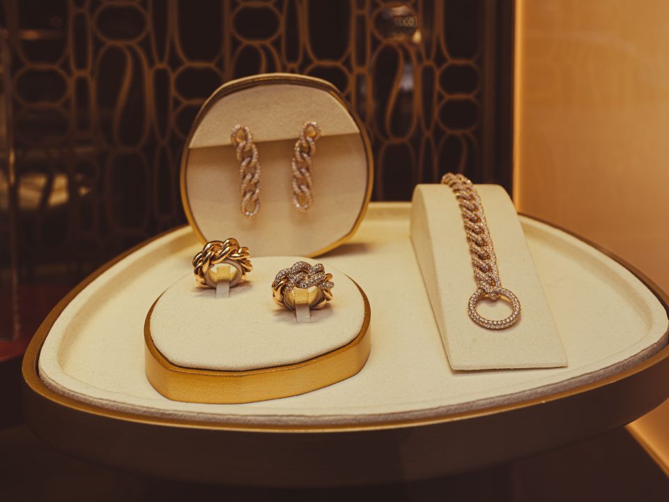 Refined display of gold jewelry pieces in a store setting