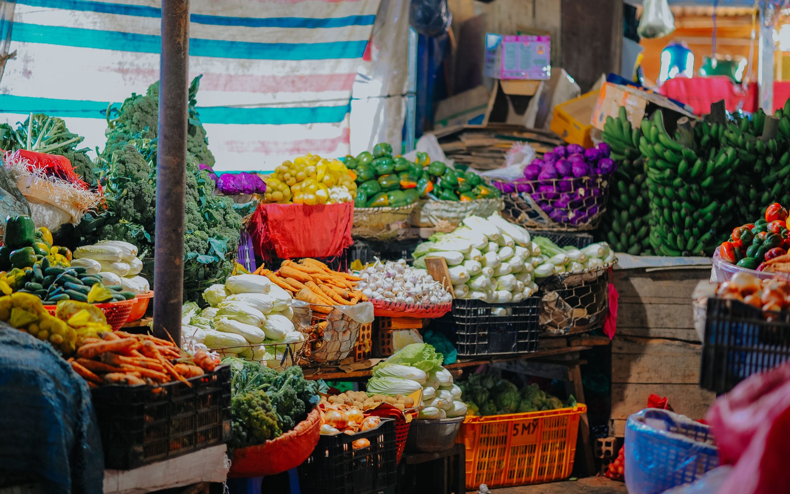 Fresh vegetables and produce stocked in crates for a restaurant kitchen