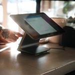 Modern restaurant POS tablet terminal on a counter