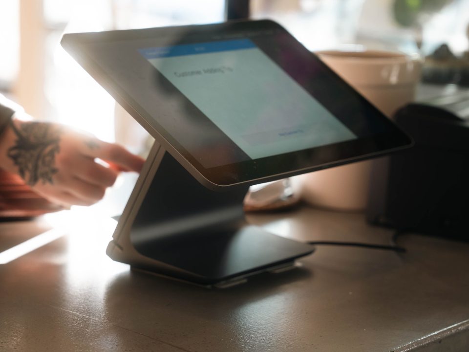 Modern restaurant POS tablet terminal on a counter