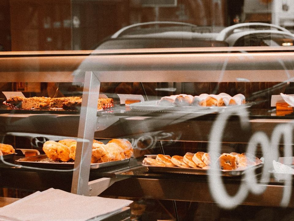 Assorted fresh breads and pastries displayed in a bakery shop
