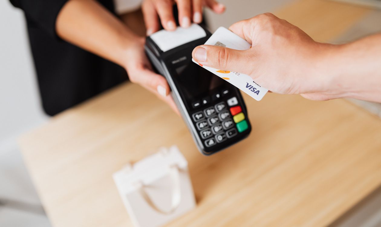 Close-up of a contactless card payment on a POS terminal