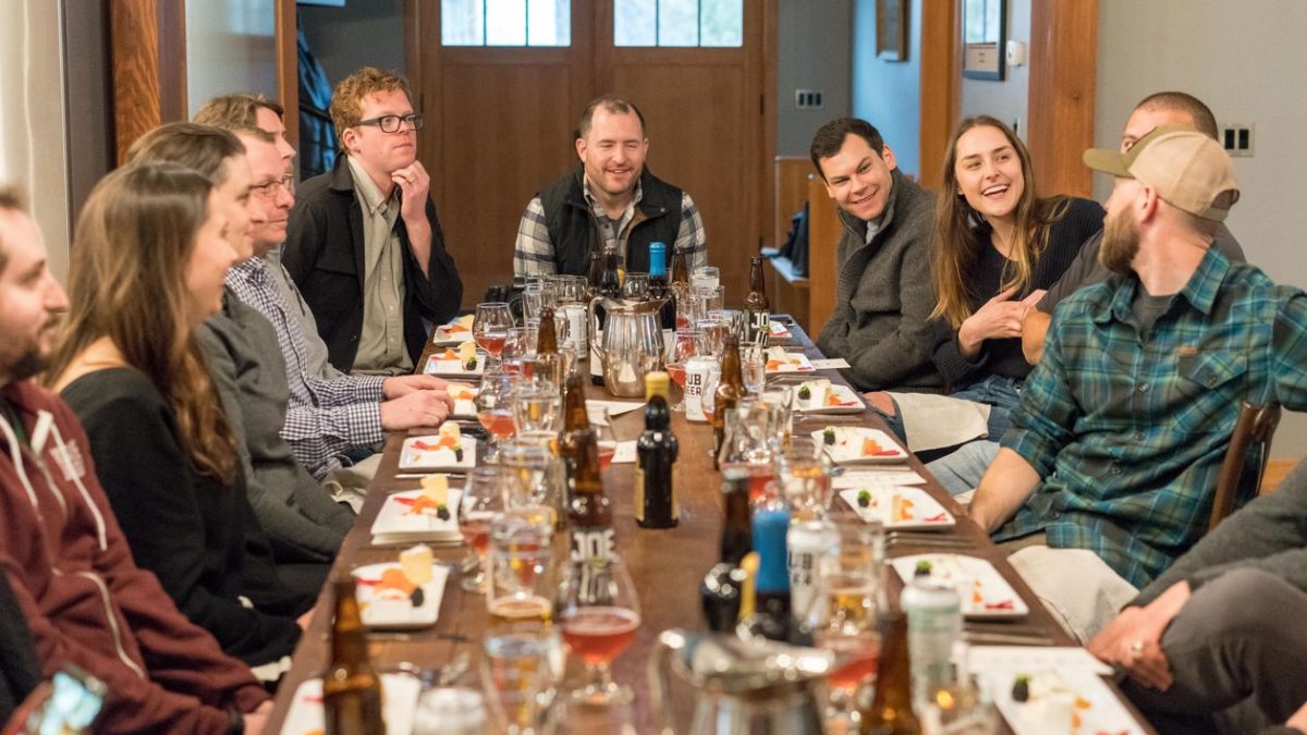 Group of guests dining together at a restaurant table