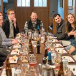 Group of guests dining together at a restaurant table